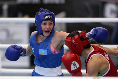 Sofia, Bulgaria. 27th February, 2021. Stoyka Krasteva (red) of Bulgaria and Angelina Lukas of Kazakhstan fight in their final round of Fly (W51kg) category of the 72-nd International Boxing Tournament "Strandja" 2021.のeditorial素材