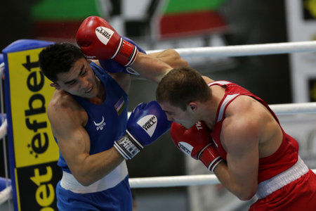Sofia, Bulgaria. 27th February, 2021. Ruslan Kolesnikov (red) of Russia and Dilshodbek Ruzmetov of Uzbekistan fight in their final round of Light Heavy (81kg) category of the 72-nd International Boxing Tournament "Strandja" 2021.のeditorial素材