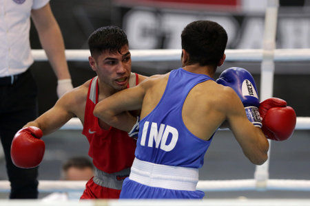 Sofia, Bulgaria. 27th February, 2021. Daniel Asenov (red) of Bulgaria and Deepak Komar of India fight in their final round of Fly (52kg) category of the 72-nd International Boxing Tournament "Strandja" 2021.のeditorial素材