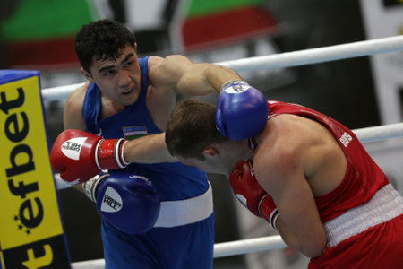 Sofia, Bulgaria. 27th February, 2021. Ruslan Kolesnikov (red) of Russia and Dilshodbek Ruzmetov of Uzbekistan fight in their final round of Light Heavy (81kg) category of the 72-nd International Boxing Tournament "Strandja" 2021.のeditorial素材