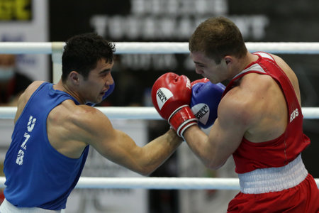 Sofia, Bulgaria. 27th February, 2021. Ruslan Kolesnikov (red) of Russia and Dilshodbek Ruzmetov of Uzbekistan fight in their final round of Light Heavy (81kg) category of the 72-nd International Boxing Tournament "Strandja" 2021.のeditorial素材