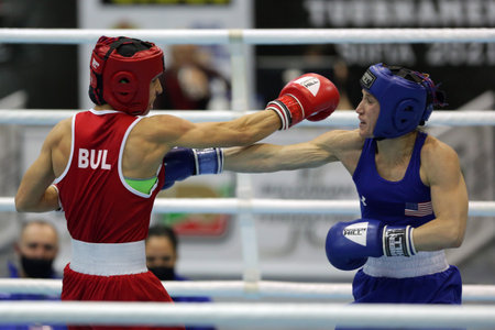 Sofia, Bulgaria - 26 February, 2021: Stoyka Krasteva (RED) of Bulgaria and Virginia Fuchs of USA fight in their semifinal round of Fly (W51kg) category of the 72-nd International Boxing Tournament "Strandja" 2021.のeditorial素材