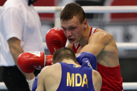 Sofia, Bulgaria. 27th February, 2021. Ilia Popov (red) of Russia and 
Alexandru Paraschiv of Moldova fight in their final round of Light (63kg) category of the 72-nd International Boxing Tournament "Strandja" 2021.のeditorial素材