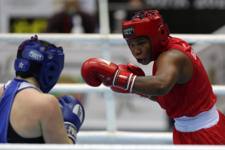Sofia, Bulgaria - 26 February, 2021: Possantos Perejra (red) of Brazil and Nadezhda Ryabets of Kazakhstan fight in their semifinal round of Middle (W75kg) category of the 72-nd International Boxing Tournament "Strandja" 2021.のeditorial素材