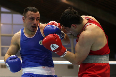 Sofia, Bulgaria. 27th February, 2021. Narek Manasyan (red) of Armenia and Radoslav Pantaleev of Bulgaria fight in their final round of Heavy (91kg) category of the 72-nd International Boxing Tournament "Strandja" 2021.のeditorial素材