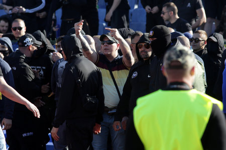 Sofia, Bulgaria: 25 April, 2021: Levski's supporters enter the stadium's track during the national championship football match between Levski and CSKA Sofia. Football fans have been allowed to attend the stadium with less than 30% of the seats amidst the のeditorial素材