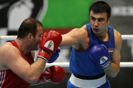 Sofia, Bulgaria. 27th February, 2021.Tsotne Rogava (red) of Ukraine and Bakhodir Jalolov of Uzbekistan fight in their final round of Super Heavy (+91kg) category of the 72-nd International Boxing Tournament "Strandja" 2021.のeditorial素材