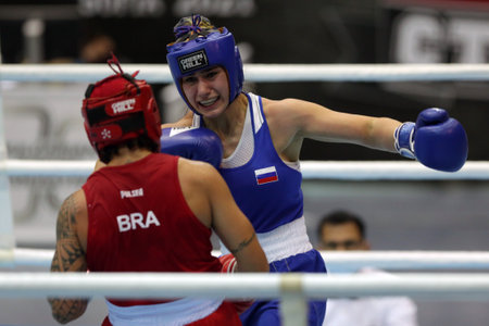 Sofia, Bulgaria - 26 February, 2021: Beatriz Ferreira (red) of Brazil and Nune Asatrian of Russia fight in their semifinal round of Light Welter (W60kg) category of the 72-nd International Boxing Tournament "Strandja" 2021.のeditorial素材