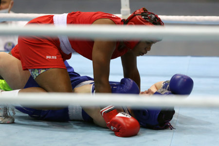 Sofia, Bulgaria - 26 February, 2021: Possantos Perejra (red) of Brazil and Nadezhda Ryabets of Kazakhstan fight in their semifinal round of Middle (W75kg) category of the 72-nd International Boxing Tournament "Strandja" 2021.のeditorial素材