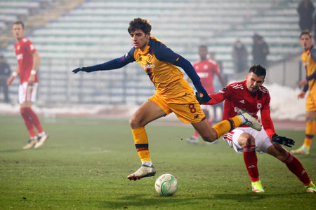 Sofia, Bulgaria - 9 December, 2021: Player of CSKA Sofia in action against Gonzalo Villar (L) of AS Roma during the UEFA Europa Conference League group C soccer match between CSKA Sofia and AS Roma.のeditorial素材