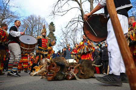Sofia, Bulgaria - 9 January, 2022: Costumed people, mask dancers called Kukeri, perform a traditional dance during the Surva Festival to ward off evil spirits in In ancient times.のeditorial素材