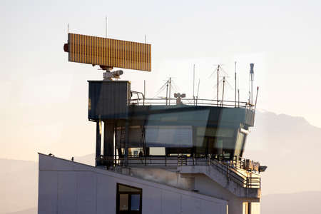 Airport tower with a radar on it.の写真素材