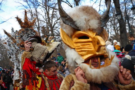 Sofia, Bulgaria - 9 January, 2022: Costumed people, mask dancers called Kukeri, perform a traditional dance during the Surva Festival to ward off evil spirits in In ancient times.のeditorial素材