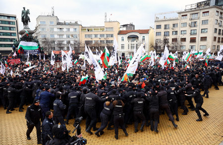 Sofia, Bulgaria - 12 January, 2022: People try to enter the Bulgarian Parliament building during a protest against green certificate (EU Digital COVID Certificate) and vaccination against COVID-19.のeditorial素材