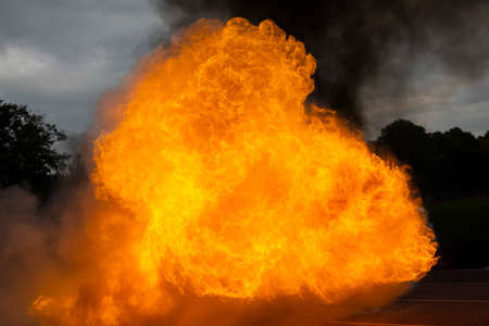 Real hot fire with smoke on the side.の写真素材