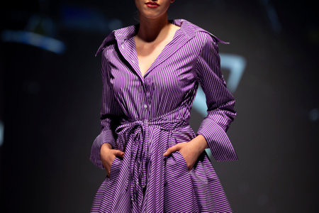 A female model presents a creation during a Fashion week. Purple dress.の写真素材