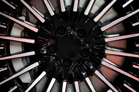 Close-up of an alloy wheel, brake caliper and disk of a car.