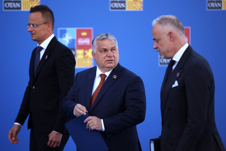 Spain, Madrid - 30 June, 2022: Hungary's President Viktor Orban (C), Defence Minister Kristof Szalay-Bobrovniczky (R) and Foreign Minister Peter Szijjarto (L) attend the NATO summit in Madrid, Spain.のeditorial素材
