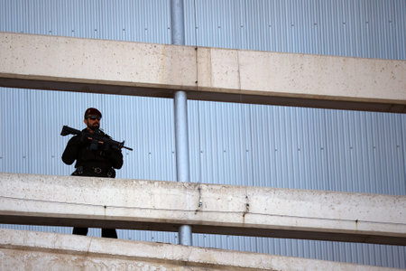 Spain, Madrid - 30 June, 2022: Spanish security police officer guards the NATO summit in Madrid, Spain.のeditorial素材