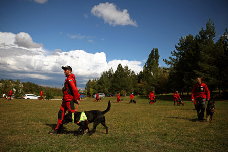 Lozen, Bulgaria - 21 September, 2022: Bulgarian Red Cross paramedics participate in a demonstration with their dogs.のeditorial素材