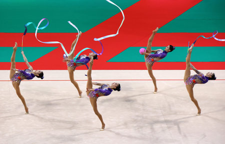 Sofia, Bulgaria - 16 September, 2022: Members of team China in action with 2 balls and 3 ribbons during the 39th FIG Rhythmic Gymnastics World Championships.のeditorial素材