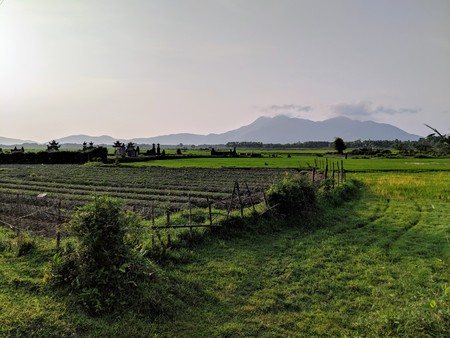 Vietnamese Landscape with Houses and Mountains in the backgroundの写真素材