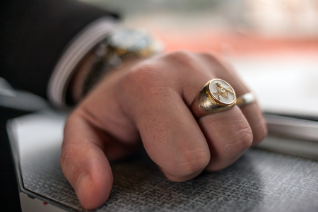 Square and Compasses ring on a man's handの写真素材