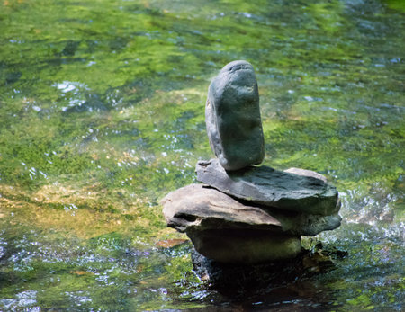 balancing rock in the river