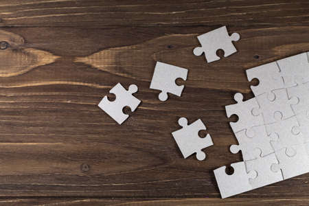 Paper puzzles on a floorの写真素材