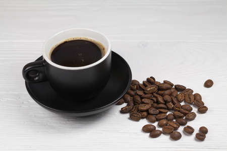 coffee mug and coffee breans on wood backgoundの写真素材