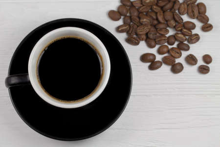 coffee mug and coffee breans on wood backgoundの写真素材