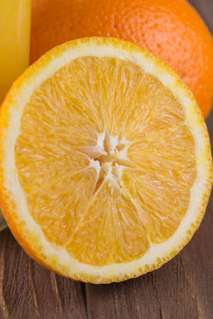 Fresh ripe orange on a wooden background. Close upの写真素材