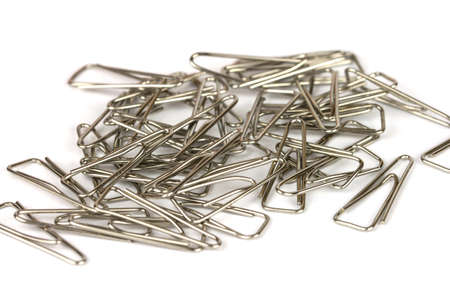 Heap of metal clips isolated on a white backgroundの写真素材