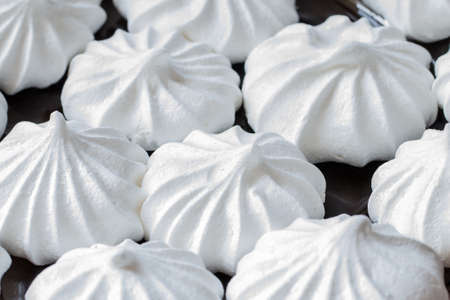 White mini meringues. Food backgroundの写真素材