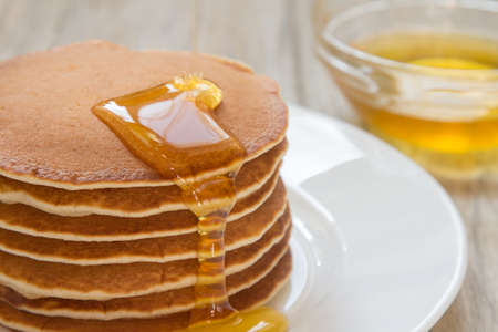 Fresh and delicious pancake with honeyの写真素材