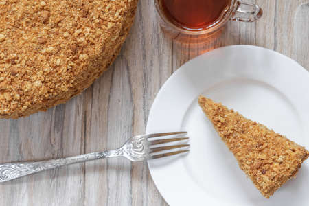 Round cake napoleon on a wooden background. Close upの写真素材