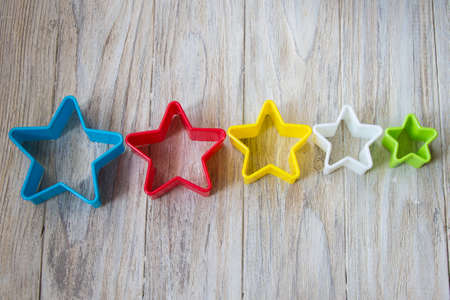 Bakeware in shape star on a wooden background, close upの写真素材