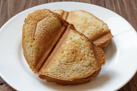 Baked bread toast on white plate, close-upの写真素材