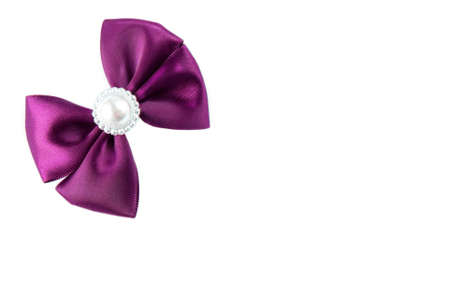 Purple satine bow isolated on whiteの写真素材
