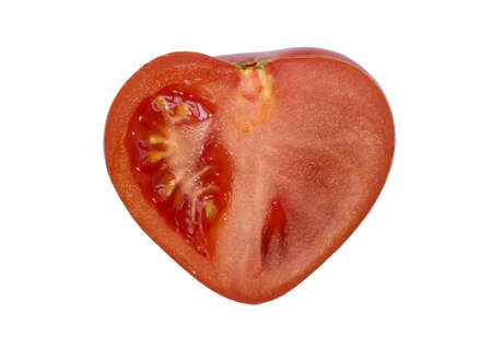 Heart-shaped half of tomato isolated on whiteの写真素材