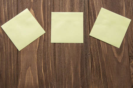 three yellow post-in notesの写真素材