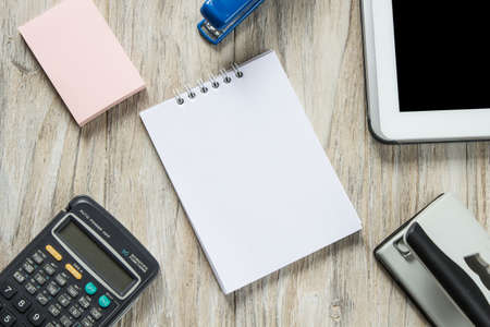 Office tools organized on white wooden backgroundの写真素材