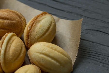 Cookies with condenced milk on cooking paperの写真素材