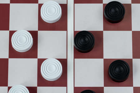 Checkers on gaming board top viewの写真素材