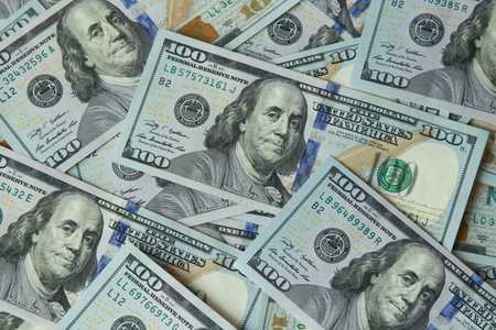 One hundred dollar banknotes scattered