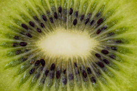 Kiwi fruit cuted in a half top macro viewの写真素材