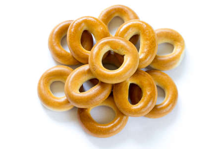Heap of baked dry bagels on white background close-upの写真素材