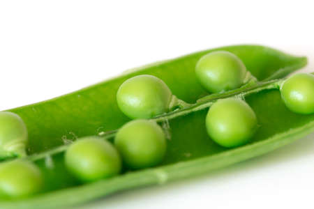 Open snap peas isolated on white background, close upの写真素材