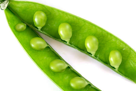 Open fresh green peas isolated on white background, close upの写真素材
