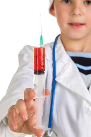 Syringe closeup full of liquid in the doctors handの写真素材